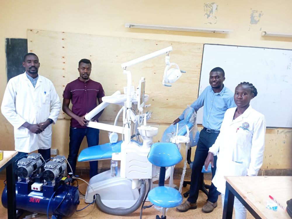 Jodroc engineers handing over a dental unit and compressor to clinical staff
