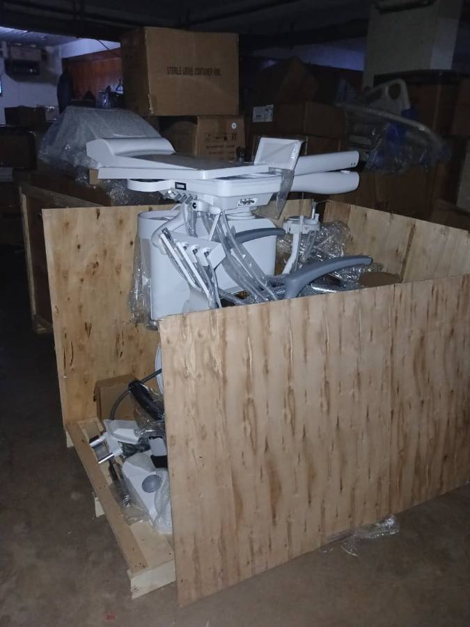 A dental chair and delivery unit crated at the store