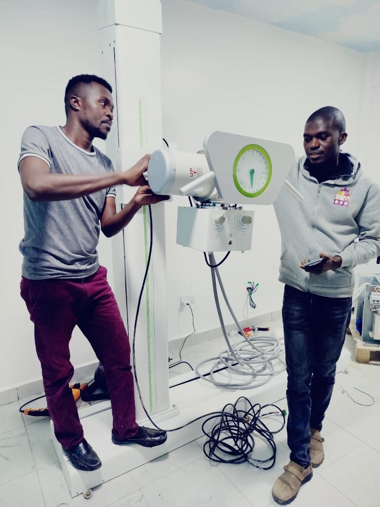 Jodroc staff training clinical users on a defibrillator with a manikin