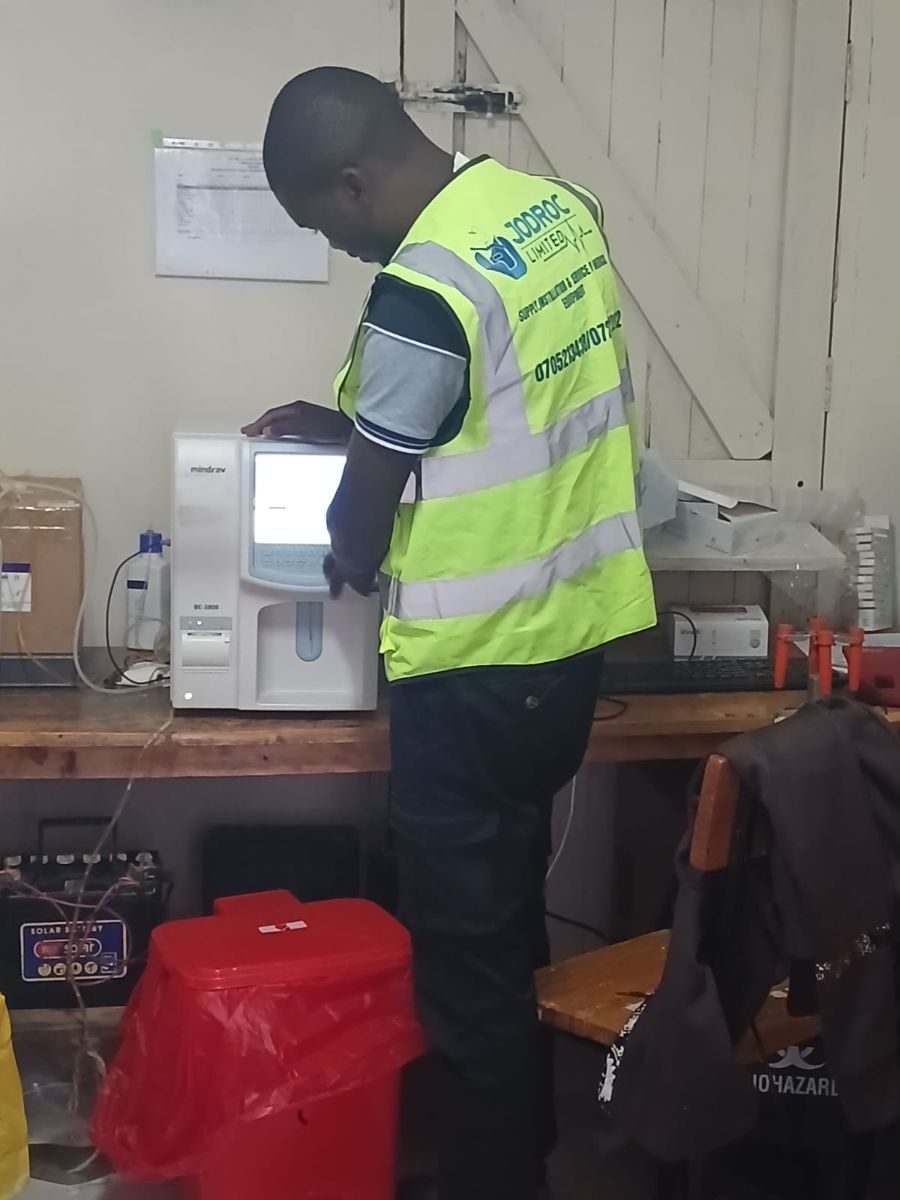 Jodroc engineer commissioning a haematology analyser on a laboratory bench